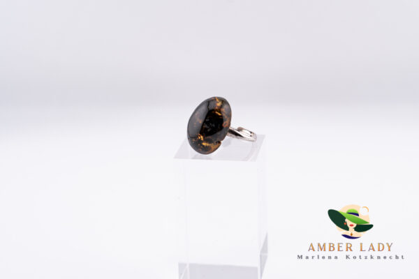 Dark amber ring sterling silver with adjustable band.