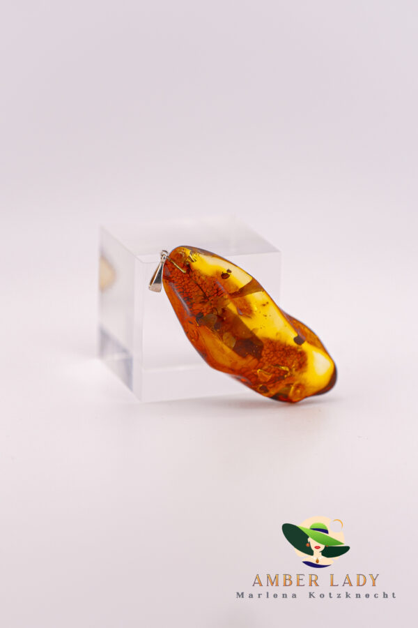 Amber pendant on sterling silver,total length 8 cm.