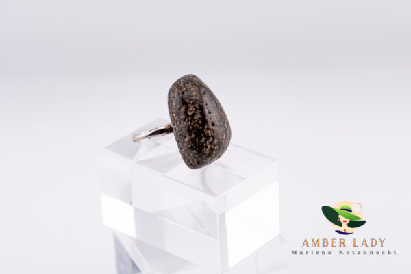 Dark chocolate amber ring with adjustable band.