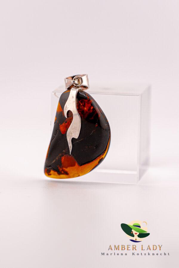 Amber pendant on sterling silver,total length 7 cm.