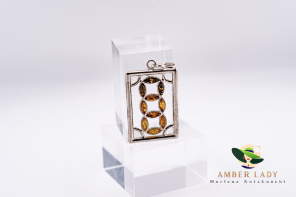 Sterling silver pendant with multicolor amber,total length 5,5 cm.