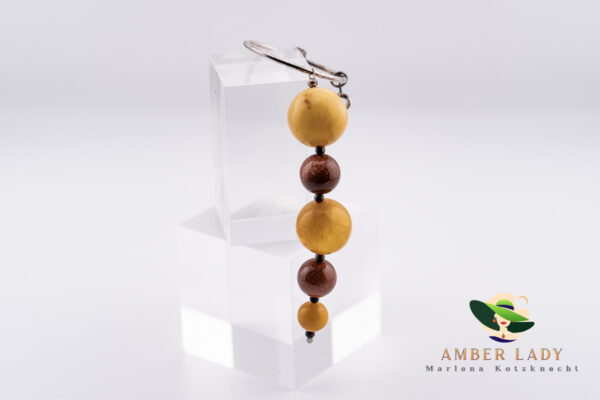 Amber and desert sand pendant natural beauty.