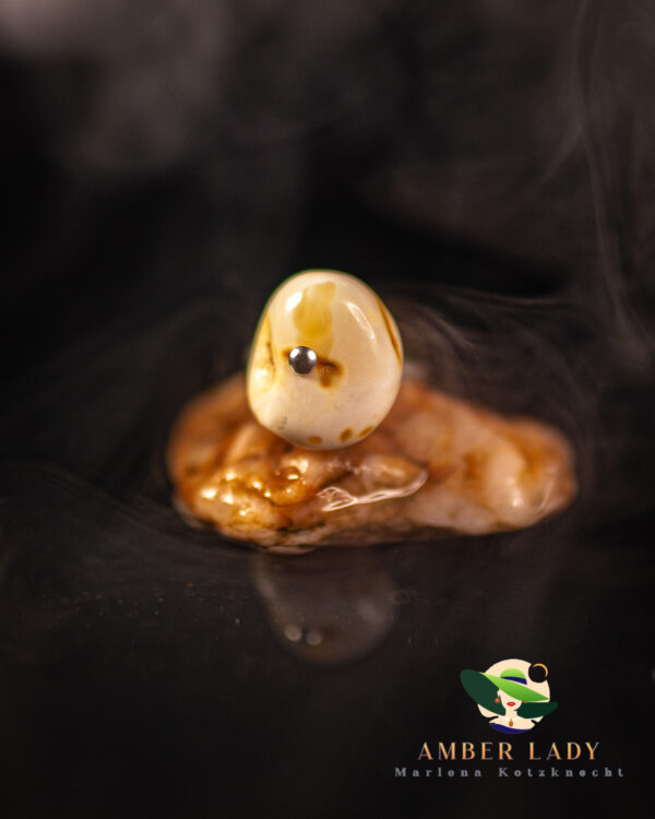 Cream amber ring on sterling silver with adjustable.