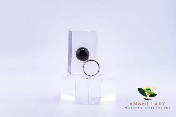 Sterling silver ring with cherry amber ,adjustable.